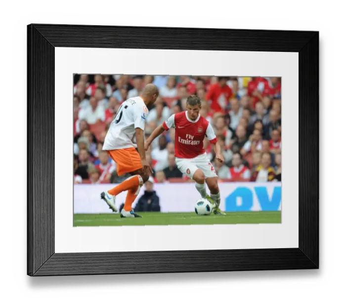 Framed Print : Andrey Arshavin (Arsenal) Alex Baptiste (Blackpool). Arsenal 6: 0 Blackpool Framed Print : Andrey Arshavin (Arsenal) Alex Baptiste (Blackpool). Arsenal 6: 0 Blackpool