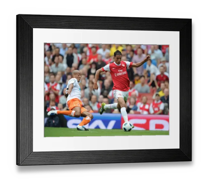 Framed Print : Marouane Chamakh (Arsenal) Alex Baptiste (Blackpool). Arsenal 6: 0 Blackpool