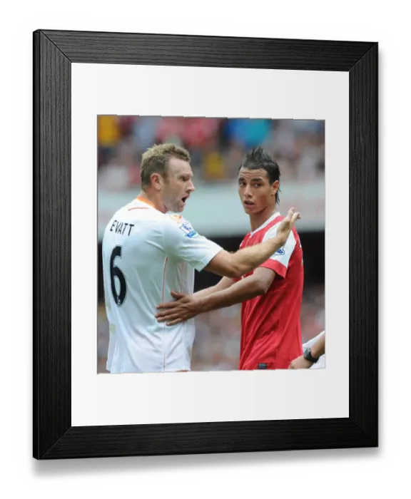 Framed Print : Marouane Chamakh (Arsenal) and Ian Evatt (Blackpool). Arsenal 6: 0 Blackpool