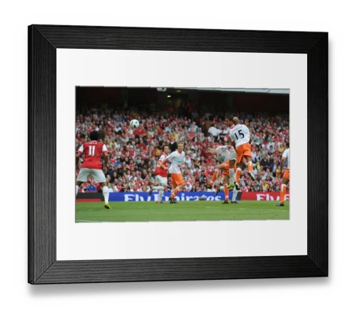 Framed Print : Marouane Chamakh heads past Blackpool goalkeeper Matthew Gilks to score the 6th Arsenal goal
