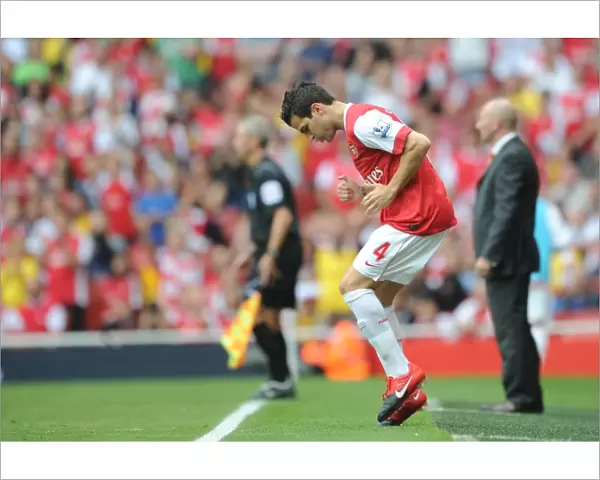 Arsenal substitute Cesc Fabregas warms up. Arsenal 6: 0 Blackpool, Barclays Premier League