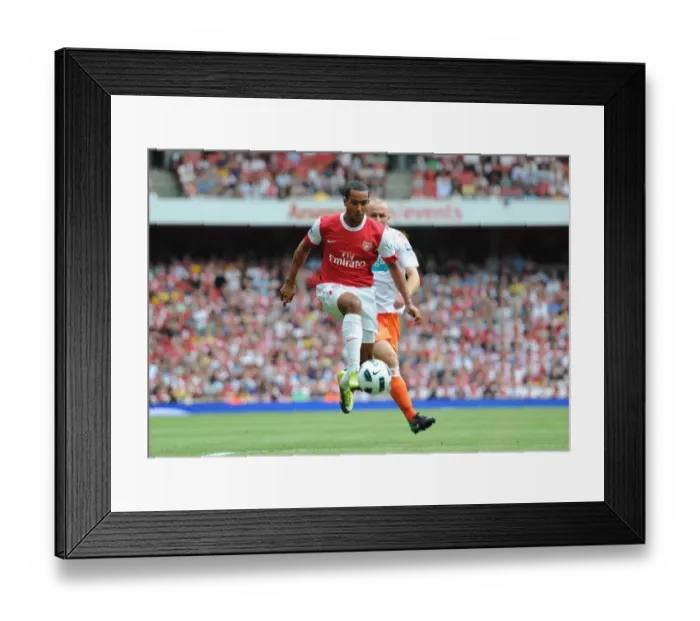Framed Print : Theo Walcott's Hat-Trick: Arsenal Crushes Blackpool 6-0