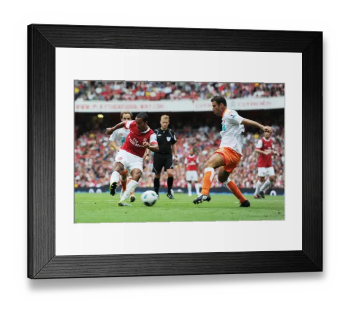Framed Print : Theo Walcott shoots past Blackpool defender Dekel Keinan to score the 3rd Arsenal goal Framed Print : Theo Walcott shoots past Blackpool defender Dekel Keinan to score the 3rd Arsenal goal
