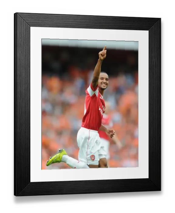 Framed Print : Theo Walcott celebrates scoring the 5th Arsenal goal. Arsenal 6: 0 Blackpool