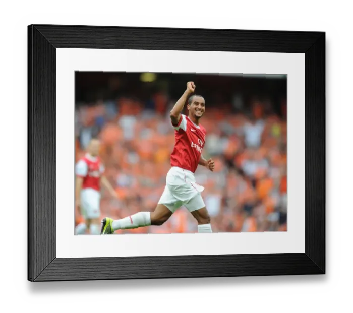 Framed Print : Theo Walcott's Brace: Arsenal's Impressive 6-0 Victory over Blackpool Framed Print : Theo Walcott's Brace: Arsenal's Impressive 6-0 Victory over Blackpool