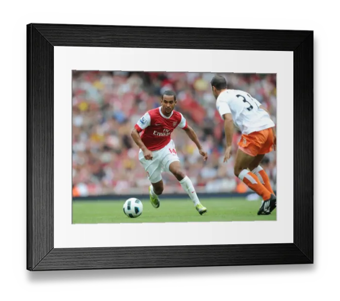 Framed Print : Theo Walcott (Arsenal) Dekel Keinan (Blackpool). Arsenal 6: 0 Blackpool Framed Print : Theo Walcott (Arsenal) Dekel Keinan (Blackpool). Arsenal 6: 0 Blackpool