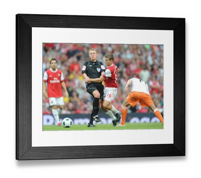 Framed Print : Jack Wilshere (Arsenal) runs into referee Mike Jones. Arsenal 6: 0 Blackpool Framed Print : Jack Wilshere (Arsenal) runs into referee Mike Jones. Arsenal 6: 0 Blackpool