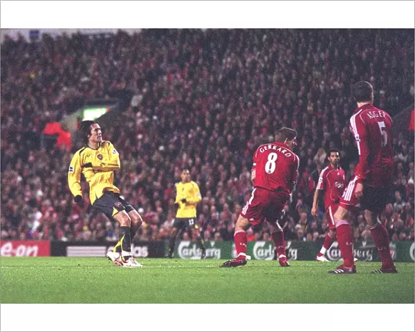 Tomas Rosicky shoots past Liverpool captain Steven Gerrard to score the 1st Arsenal goal