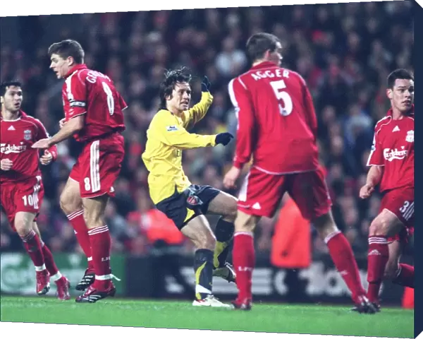 Tomas Rosicky shoots past Liverpool goalkeeper Jerzy Dudek score the 2nd Arsenal goal