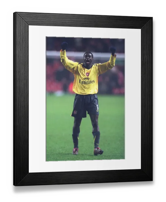 Framed Print : Arsenal defender Kolo Toure celebrates at the end of the match Framed Print : Arsenal defender Kolo Toure celebrates at the end of the match