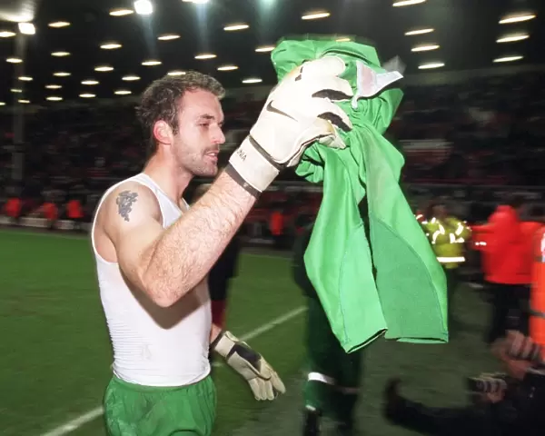 Manuel Almunia (Arsenal) throws his shirt to the fans after the match
