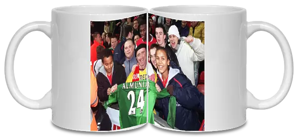 Arsenal fans with Manuel Almunias shirt after the match