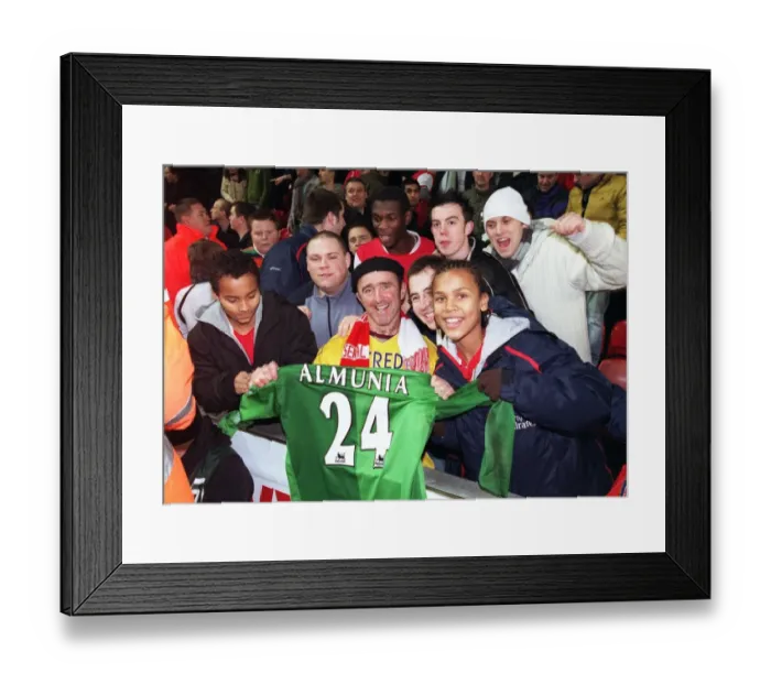 Framed Print : Arsenal fans with Manuel Almunias shirt after the match