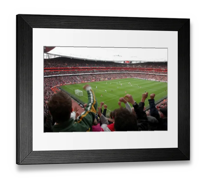 Framed Print : Fans jump up in the upper terrace to celebrate Emmanuel Adebayor scoring Arsenals 1st goal Framed Print : Fans jump up in the upper terrace to celebrate Emmanuel Adebayor scoring Arsenals 1st goal