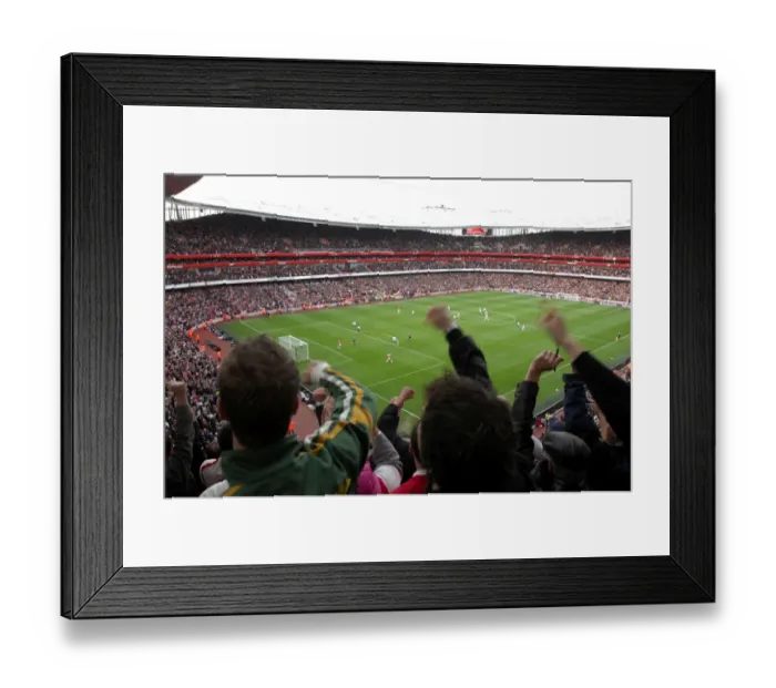 Framed Print : Adebayor's Euphoric Goal: Arsenal Crushes Tottenham 3-0