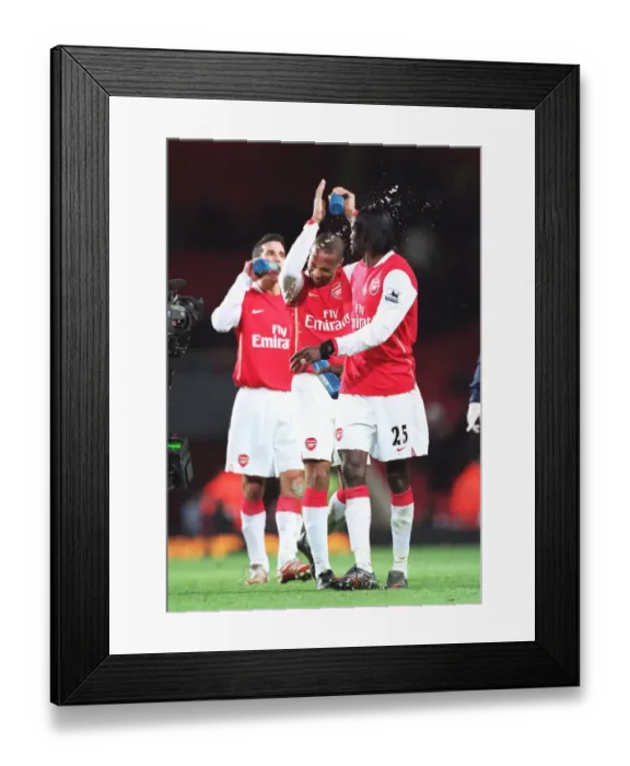 Framed Print : Emmanuel Adebayor squirts water at Thierry Henry (Arsenal) at the end of the match Framed Print : Emmanuel Adebayor squirts water at Thierry Henry (Arsenal) at the end of the match