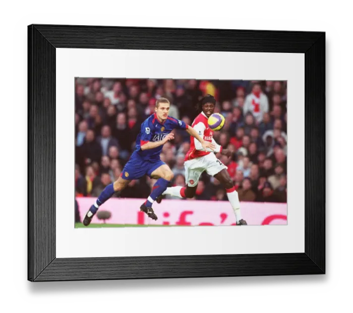 Framed Print : Adebayor vs. Vidic: Arsenal's Edge over Manchester United in the FA Premiership (21 / 01 / 07)