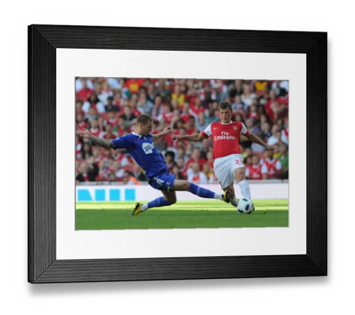 Framed Print : Arsenal's Andrey Arshavin Scores against Bolton's Gretar Steinsson in Arsenal's 4-1 Victory over Blackburn Rovers