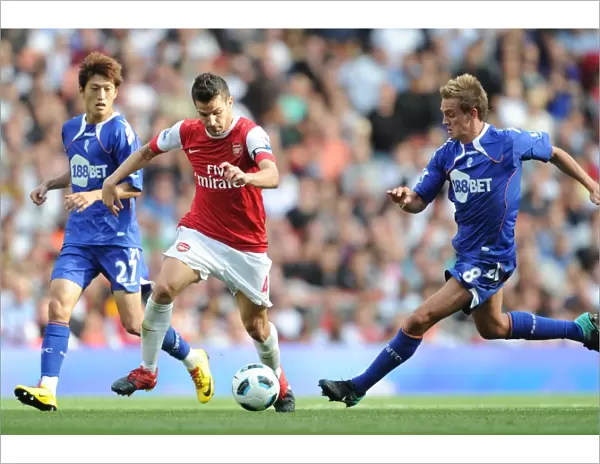 Cesc Fabregas (Arsenal) Stuart Holden and Chung-Yong Lee (Bolton). Arsenal 4