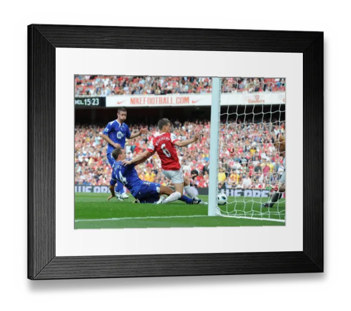 Framed Print : Koscielny Stunner: Arsenal's First Goal vs. Bolton (4-1) Framed Print : Koscielny Stunner: Arsenal's First Goal vs. Bolton (4-1)