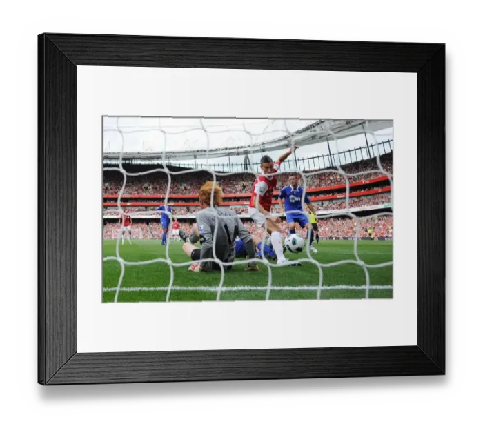 Framed Print : Laurent Koscielny shoots past Bolton goalkeeper Adam Bogdan to score the 1st Arsenal goal Framed Print : Laurent Koscielny shoots past Bolton goalkeeper Adam Bogdan to score the 1st Arsenal goal
