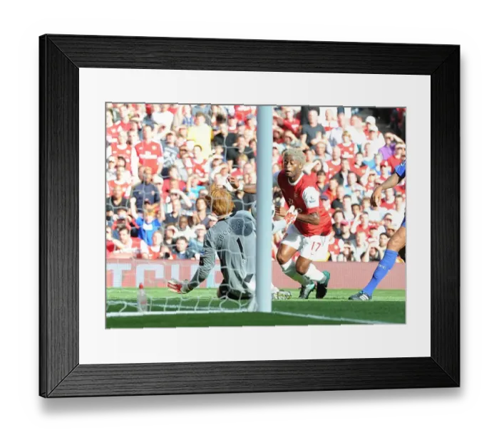 Framed Print : Alex Song chips the ball over Bolton goalkeeper Adam Bogan to score the 3rd Arsenal goal