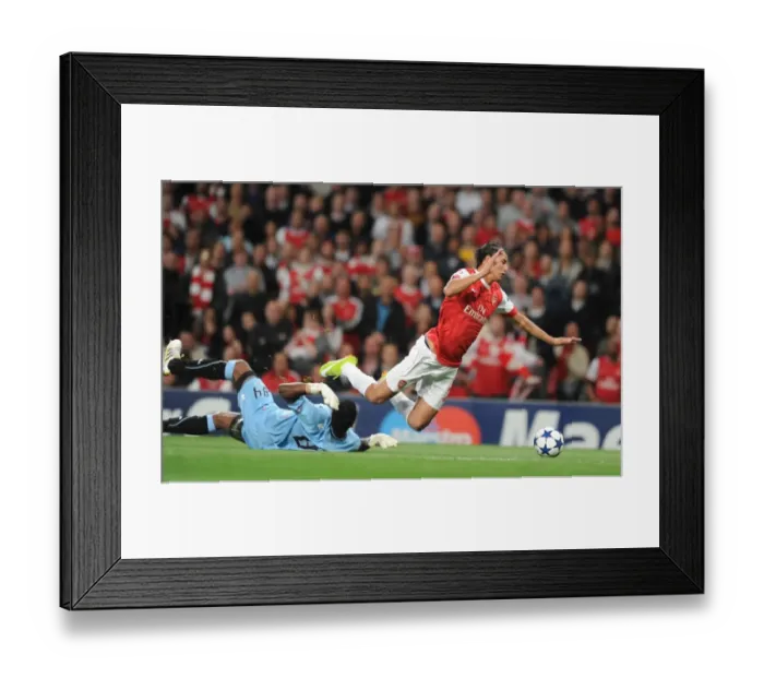 Framed Print : Marouane Chamakh is tripped by Braga goalkeeper Felipe for the Arsenal penalty