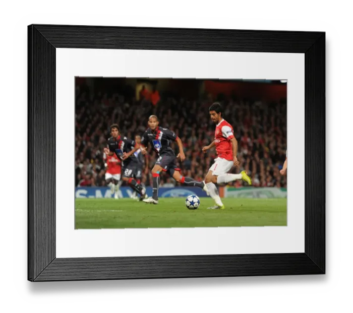 Framed Print : Carlos Vela chips the ball over Braga goalkeeper Felipe to score the 5th Arsenal goal Framed Print : Carlos Vela chips the ball over Braga goalkeeper Felipe to score the 5th Arsenal goal