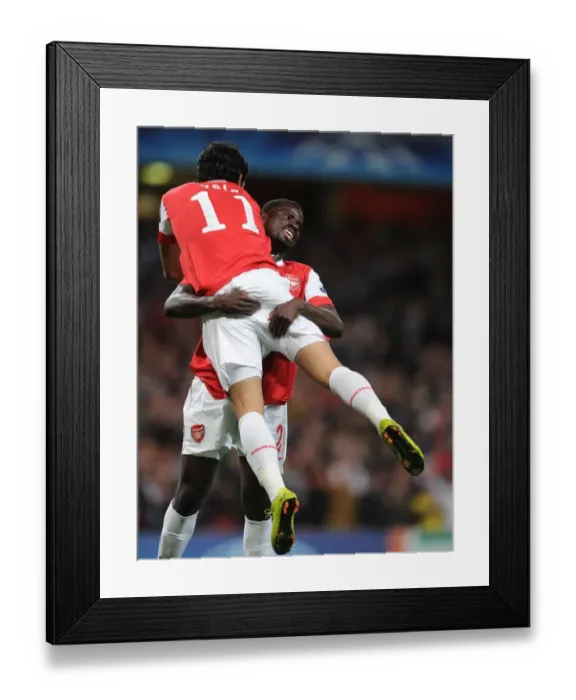 Framed Print : Carlos Vela and Emmanuel Eboue: Arsenal's Unstoppable Duo Celebrates Fifth Goal in 6-0 Rout of SC Braga