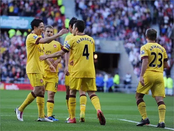 Cesc Fabregas celebrates scoring the Arsenal goal with Samir Nasri, Marouane Chamakh