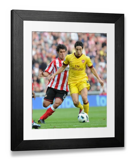 Framed Print : Samir Nasri (Arsenal) Cristian Riveros (Sunderland). Sunderland 1: 1 Arsenal Framed Print : Samir Nasri (Arsenal) Cristian Riveros (Sunderland). Sunderland 1: 1 Arsenal