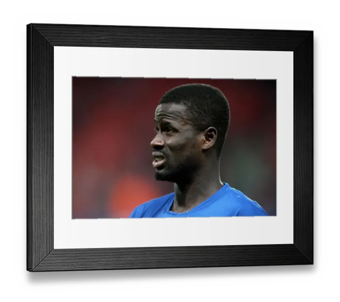 Framed Print : Arsenal's Emmanuel Eboue Shines in 6-0 UEFA Champions League Victory over SC Braga