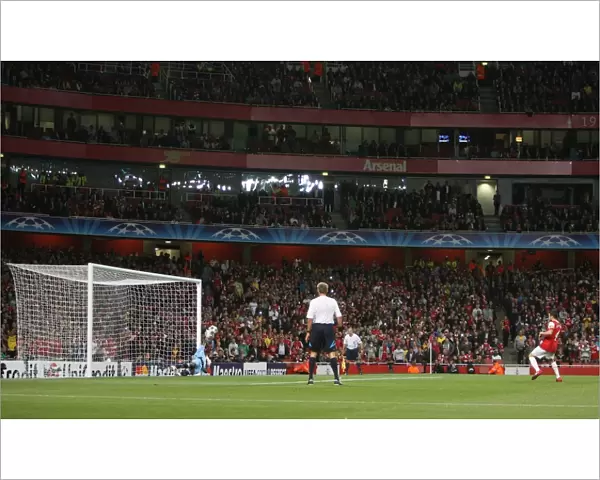 Cesc Fabregas scores Arsenals 1st goal from the penalty spot past Felipe (Braga)