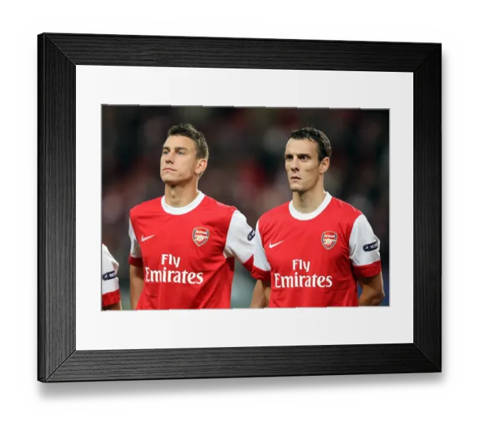 Framed Print : Arsenal's Unstoppable Defense: Koscielny and Squillaci Shine in 6-0 Victory over SC Braga (UEFA Champions League, Group H, Emirates Stadium, 2010)