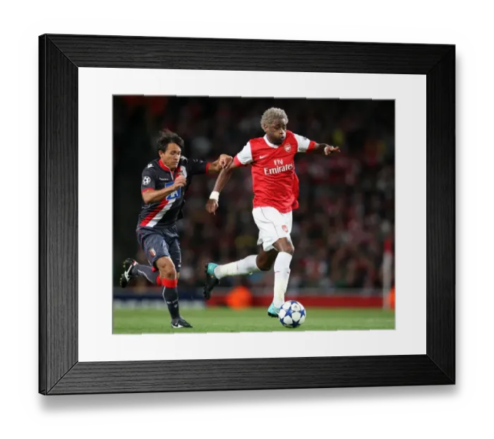 Framed Print : Arsenal's Dominance: Alex Song Shines in 6-0 UEFA Champions League Victory over SC Braga Framed Print : Arsenal's Dominance: Alex Song Shines in 6-0 UEFA Champions League Victory over SC Braga