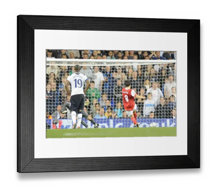 Framed Print : Samir Nasri shoots past Tottenham goalkeeper Stiope Pletikosa to score the 3rd Arsenal goal