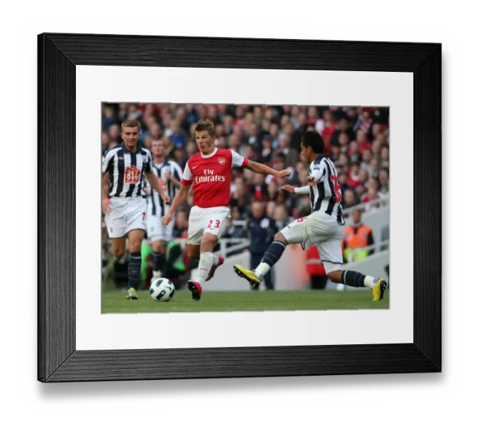 Framed Print : Arsenal's Andrey Arshavin Faces Off Against Gonzalo Jara of West Bromwich Albion in Intense Barclays Premier League Clash Framed Print : Arsenal's Andrey Arshavin Faces Off Against Gonzalo Jara of West Bromwich Albion in Intense Barclays Premier League Clash