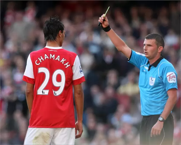 Marouane Chamakh (Arsenal) is shown the yellow card. Arsenal 2: 3 West Bromwich Albion