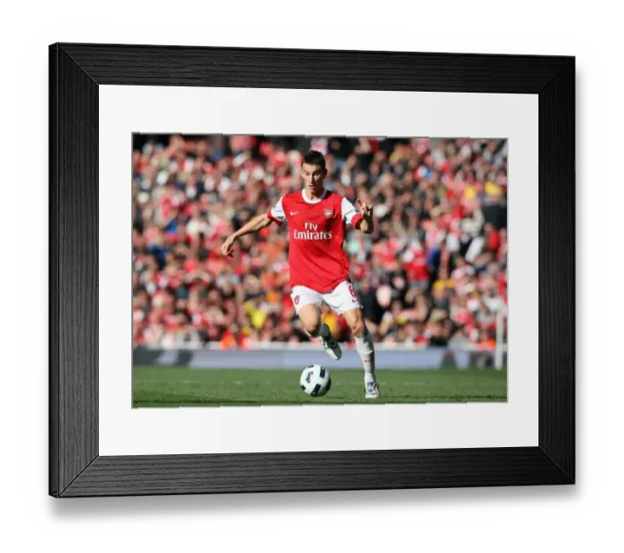 Framed Print : Laurent Koscielny's Heartbreaking Defeat: Arsenal 2-3 West Bromwich Albion