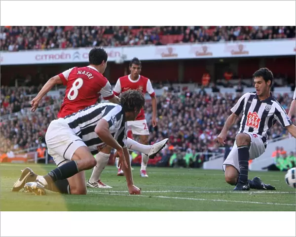 Sammir Nasri scores Arsenals 1st goal past Pablo Ibanez (WBA). Arsenal 2
