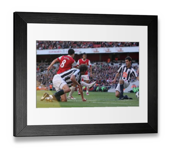 Framed Print : Sammir Nasri scores Arsenals 1st goal past Pablo Ibanez (WBA). Arsenal 2 Framed Print : Sammir Nasri scores Arsenals 1st goal past Pablo Ibanez (WBA). Arsenal 2