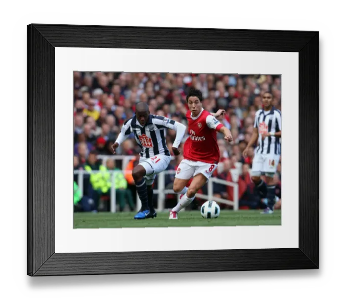 Framed Print : Arsenal's Samir Nasri Outshined by WBA's Youssouf Mulumbu: 2-3 Defeat at Emirates Stadium Framed Print : Arsenal's Samir Nasri Outshined by WBA's Youssouf Mulumbu: 2-3 Defeat at Emirates Stadium