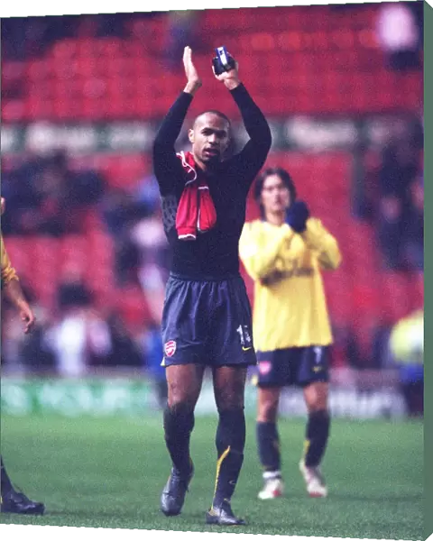 Arsenal captain Thierry Henry waves to the fans after the match