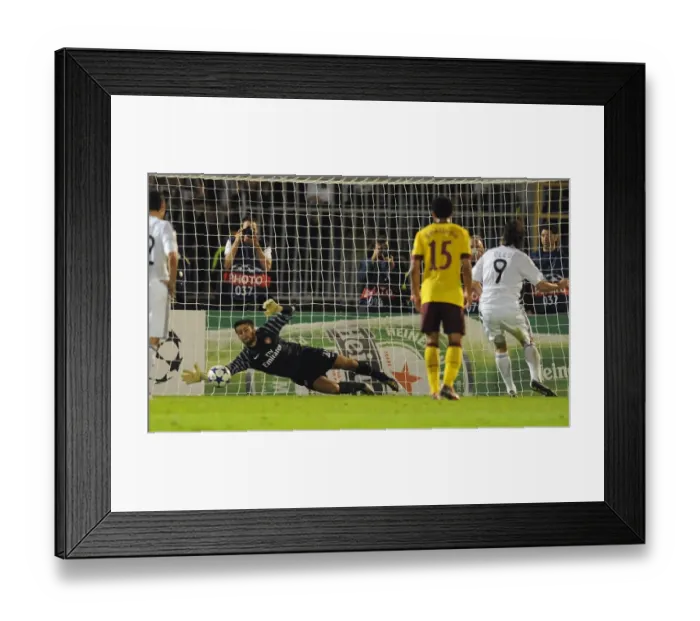 Framed Print : Arsenal goalkeeper Lucasz Fabianski saves the penalty from Cleo (Partizan)