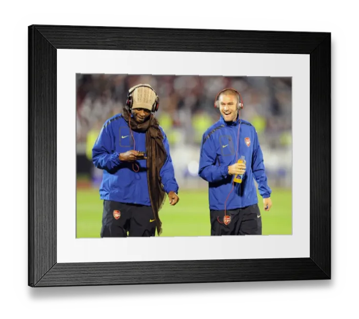 Framed Print : Henri Lansbury and Alex Song (Arsenal). Partizan Belgrade 1: 3 Arsenal. UEFA Champions League