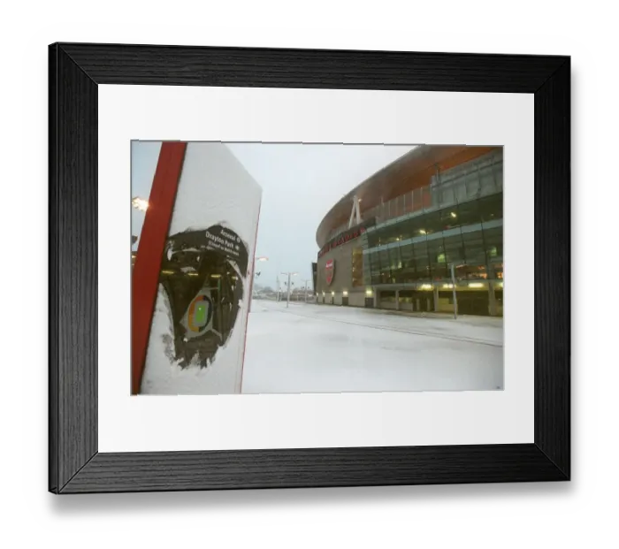 Framed Print : Winter's Embrace at Emirates: A Magical Arsenal Football Ground in Snow Framed Print : Winter's Embrace at Emirates: A Magical Arsenal Football Ground in Snow