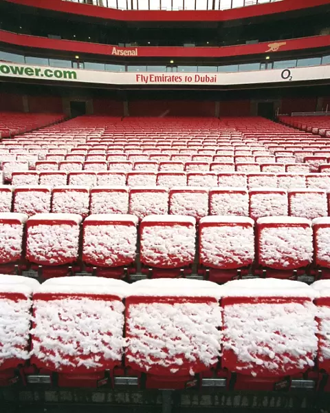 Winter's Magic at Emirates: A Snowy Arsenal Football Stadium