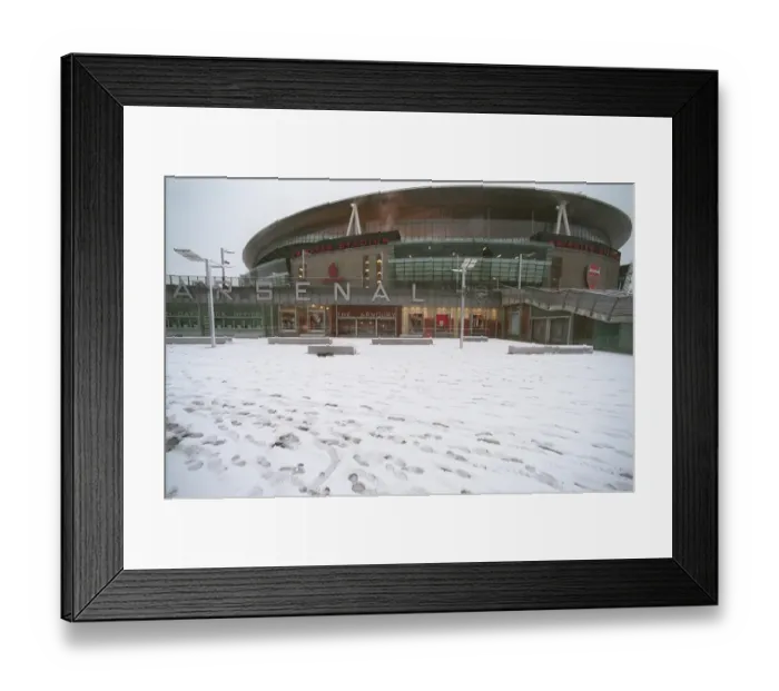 Framed Print : Winter's Embrace at Emirates: A Magical Arsenal Football Ground in Snow