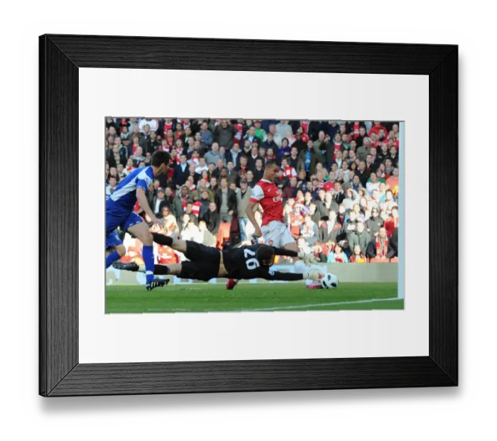 Framed Print : Marouane Chamakh shoots past Birmingham goalkeeper Ben Foster to score the 2nd Arsenal goal
