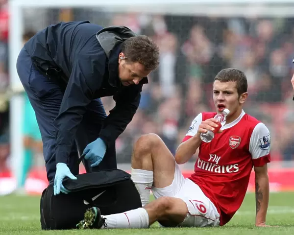 Jack Wilshere Receives Treatment for Bloody Lip during Arsenal's 2-1 Win over Birmingham City